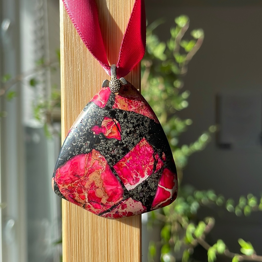 Pink and black stone pendant